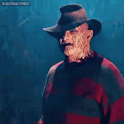 A Nightmare Before Christmas Freddy Krueger Is Wearing A Red Sweater And A Hat GIF