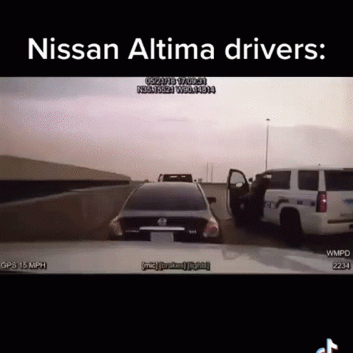 A Nissan Altima Is Driving Down A Highway Next To A Police Truck GIF