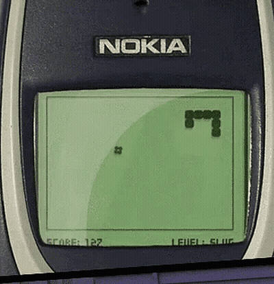 A Nokia Phone Playing A Game With A Snake On The Screen GIF