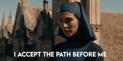 A Nun In Front Of A Building With The Words I Accept The Path Before Me Below Her GIF