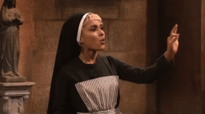 A Nun Is Standing In Front Of A Statue And Saying Why Are You Com . GIF