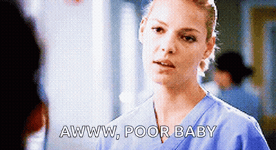 A Nurse Is Talking To A Man In A Hospital And Says Awww Poor Baby GIF