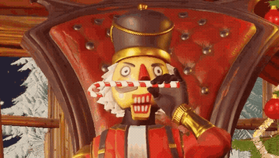 A Nutcracker Is Sitting In A Chair Holding A Candy Cane . GIF