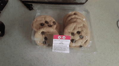 A Package Of Chocolate Chip Cookies Sitting On A Countertop GIF