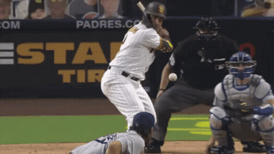 A Padres Baseball Player Is Swinging At A Ball GIF