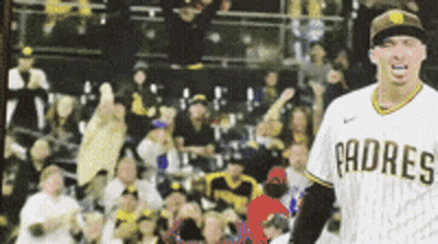 A Padres Baseball Player Stands In Front Of A Crowd Of People GIF