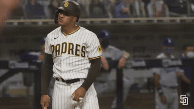 A Padres Baseball Player Wearing A Helmet Stands On The Field GIF