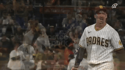 A Padres Player Stands In Front Of A Crowd GIF