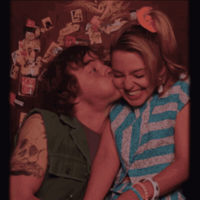 A Painting Of A Boy And A Girl With Their Tongues Out GIF