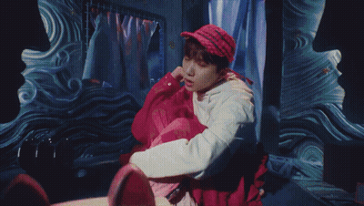 A Painting Of A Man Holding A Yellow Umbrella On A Television Screen GIF