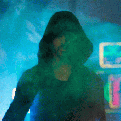 A Painting Of A Man In A Hooded Jacket With A Neon Sign In The Background GIF