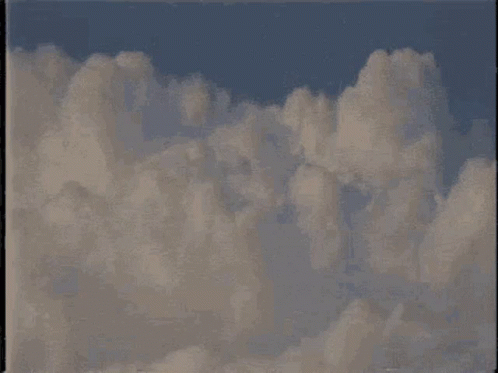 A Painting Of Clouds In A Blue Sky With A Black Frame GIF