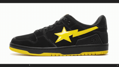 A Pair Of Black And Yellow Bape Shoes GIF
