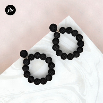 A Pair Of Black Beaded Hoop Earrings With A Jtv Logo GIF