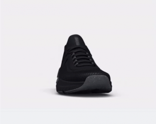 A Pair Of Black Sneakers With A Gray Sole GIF