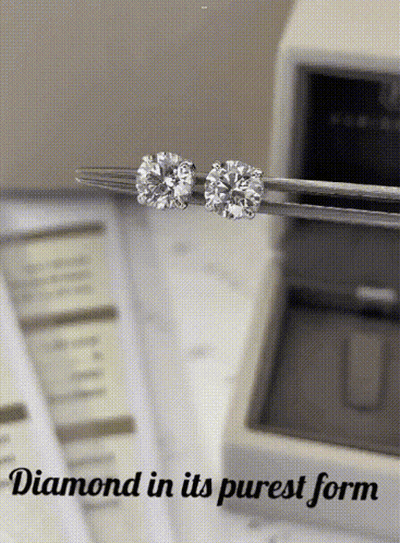 A Pair Of Diamond Stud Earrings Being Held In Tweezers With The Words " Diamond In Its Purest Form " Below Them GIF
