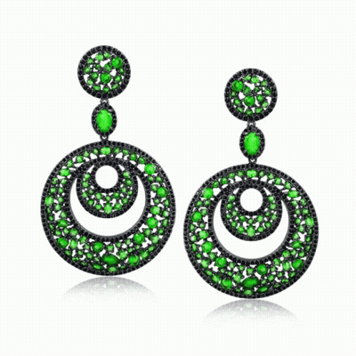 A Pair Of Earrings With Green And Black Stones On A White Background GIF