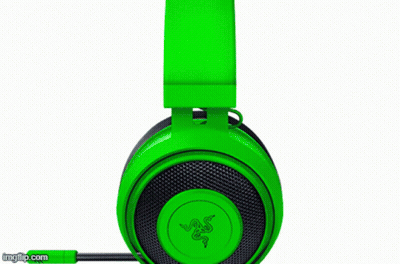 A Pair Of Green And Black Gaming Headphones With A Microphone On A Black Background . GIF