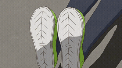 A Pair Of Green Shoes With White Soles And Arrows On Them GIF