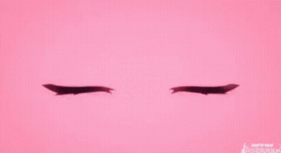 A Pair Of Pink Anime Eyes With A Smiley Face On A Pink Background . GIF