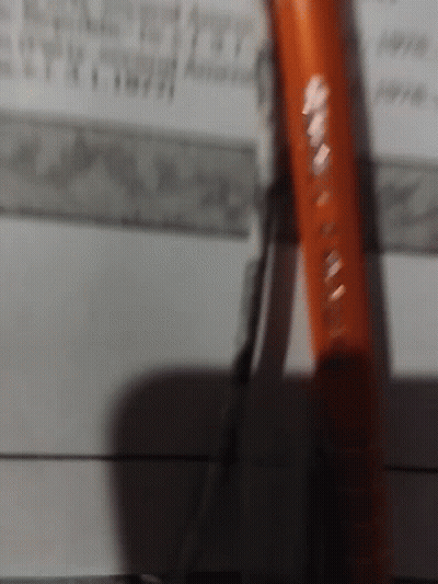 A Pair Of Pliers Is Laying On A Piece Of Paper With A Ruler In The Background GIF