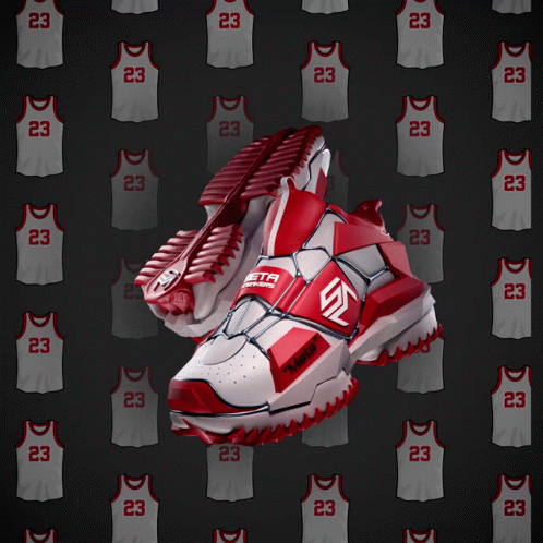 A Pair Of Red And White Basketball Shoes With The Number 23 On The Side GIF
