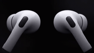 A Pair Of White Apple Airpods Pro Earbuds On A Black Background . GIF