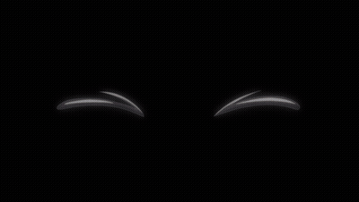 A Pair Of White Balls With Red Eyes And A Black Background GIF
