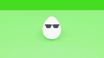 A Pair Of White Eggs With Black Spots On Them On A Green Surface GIF