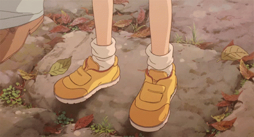 A Pair Of Yellow Shoes With The Letter D On The Side GIF
