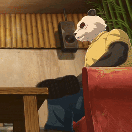 A Panda Bear In A Yellow Shirt Is Sitting In A Red Chair GIF