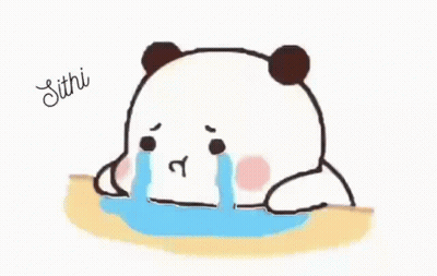 A Panda Bear Is Crying While Sitting On A Table And Tears Are Coming Out Of Its Eyes . GIF