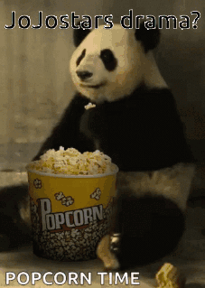A Panda Bear Is Eating A Bucket Of Popcorn GIF