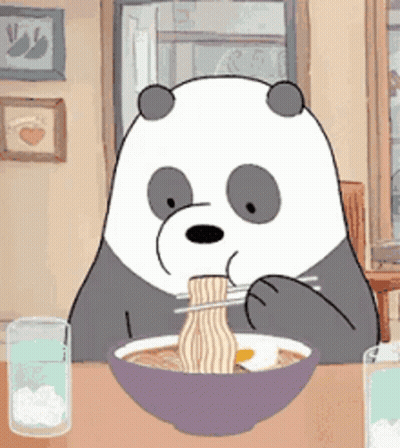 A Panda Bear Is Sitting At A Table Eating Ramen With Chopsticks . GIF