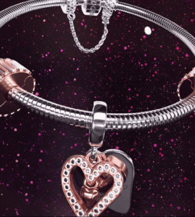 A Pandora Bracelet With A Heart Charm On It GIF
