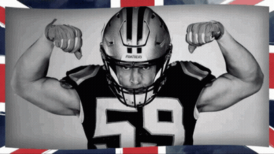A Panthers Football Player Flexes His Muscles GIF