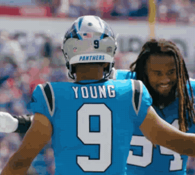A Panthers Player Wearing A Blue Jersey With The Number 9 GIF