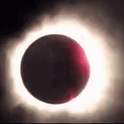 A Partial Eclipse Of The Sun With A Red Ring Around The Moon GIF