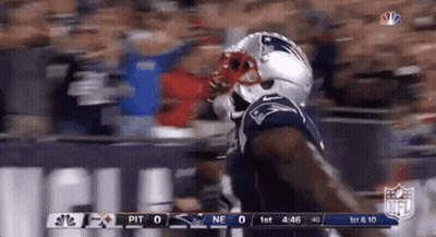A Patriots Football Player Is Running On The Field GIF