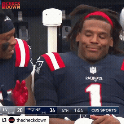A Patriots Football Player Is Sitting In The Stands During A Game GIF