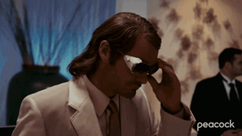 A Peacock Ad With A Man In A Suit GIF