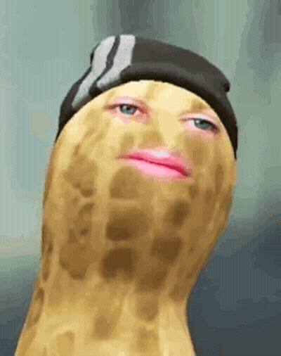 A Peanut With A Pink Lip And A Hat On . GIF
