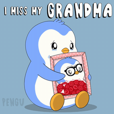 A Penguin Holding A Picture Of Another Penguin With The Words I Miss My Grandma Below It GIF