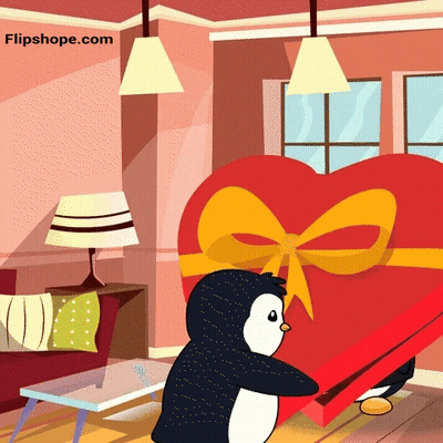 A Penguin Is Holding A Heart Shaped Box In A Living Room GIF