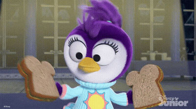A Penguin Is Holding Two Slices Of Bread In Front Of A Disney Junior Sign GIF