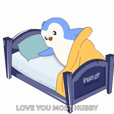 A Penguin Is Laying In A Bed That Says Puddy Penguins On It GIF