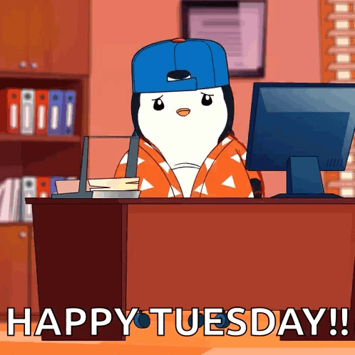 A Penguin Is Sitting At A Desk In Front Of A Computer With The Words Happy Tuesday Written On The Bottom GIF