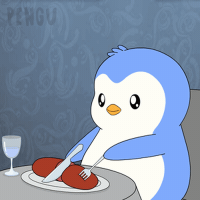A Penguin Is Sitting At A Table With A Plate Of Food And A Glass Of Water GIF
