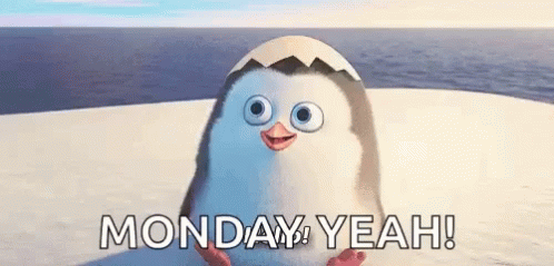 A Penguin Is Sitting On Top Of A Snow Covered Beach With The Words Monday Yeah Written Below It . GIF