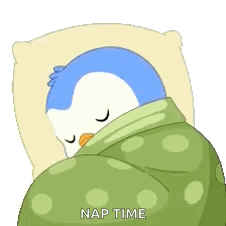 A Penguin Is Sleeping In A Bed With A Green Blanket And A Pillow . GIF